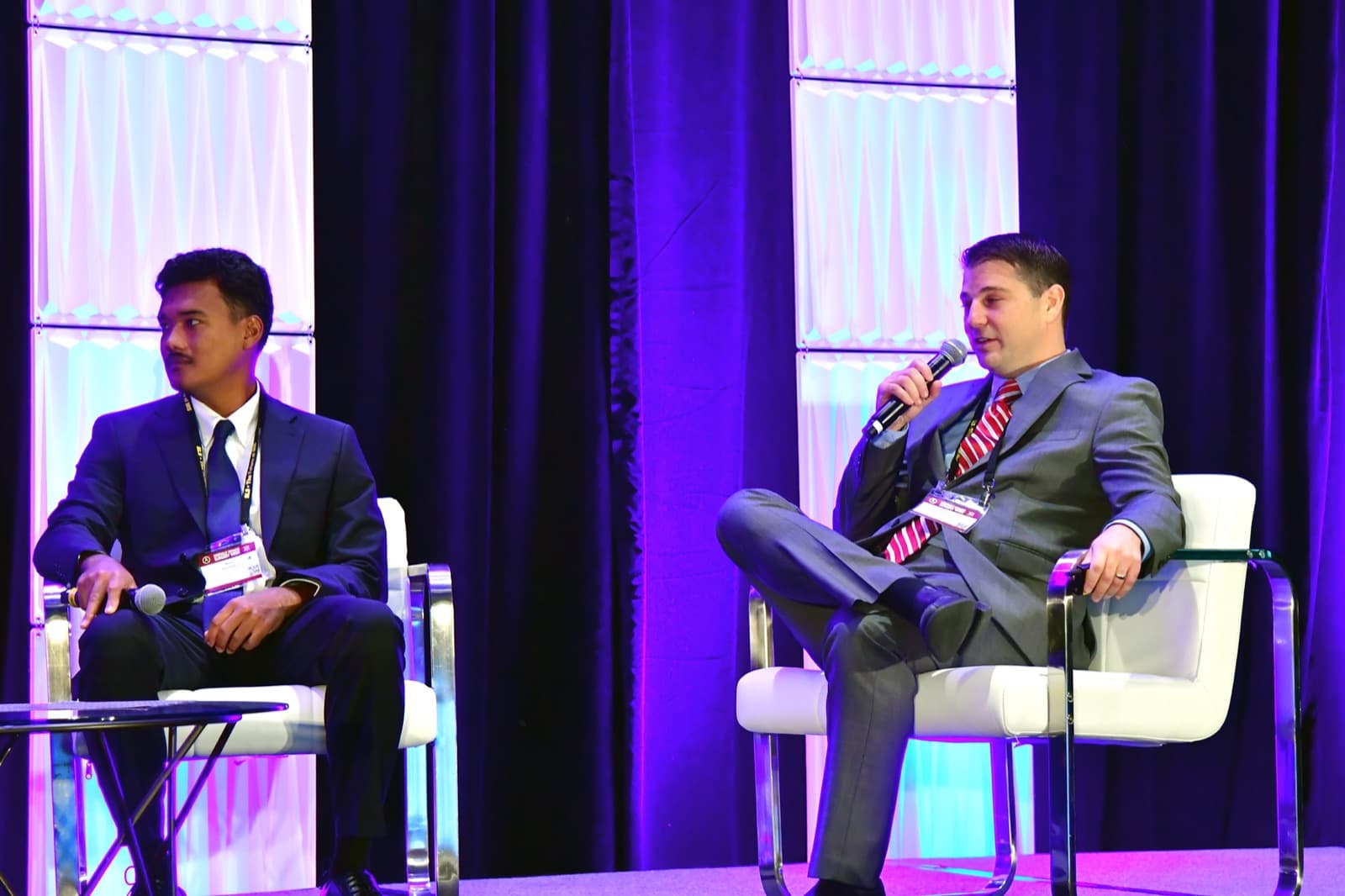 Paul Toomey, MD speaking with a microphone during a conference panel, September 2025
